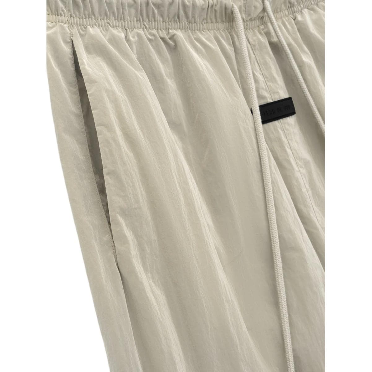 Штаны Fear of God Essentials SS24 drop2 Crinkle Nylon Trackpants GARDEN YELLOW - изображение 3